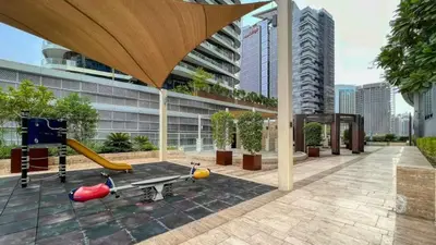 a building with a playground with a slide at TRPS - Maison Mall Street, Downtown - Close to Dubai Mall, Fully Furnished 1BR in Dubai