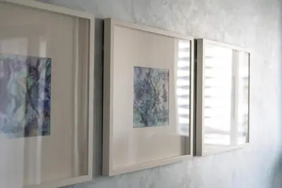 a mirror on a wall next to a window at TRPS - Maison Mall Street, Downtown - Beautifully Appointed 1BR, Near to Burj Khalifa in Dubai