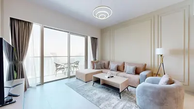 a living room with a couch and a table at Panaromic Burj Khalifa View from Balcony - Luxury 2BR next to Dubai Mall - Like Homes in Dubai