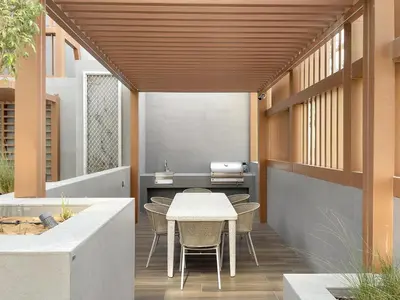 an outdoor patio with a table and chairs at Stylish 1BR in Hamilton House in Dubai