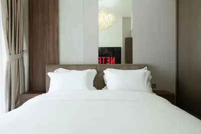 a bedroom with a large white bed with white pillows at KeyRock - Grand Bleu Escape with Iconic Palm Views in Dubai