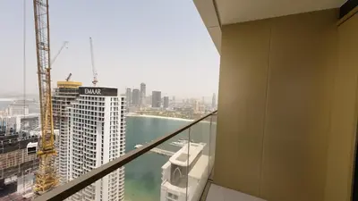 a view of a city skyline from a building at Elegant Seaside Luxury 1BR in Beachfront, Grand BLeu Tower, Pool & Gym in Dubai