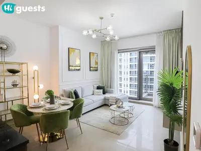 a living room with a couch and a table at HiGuests - Marina View 1 BR with Spacious Balcony in Dubai