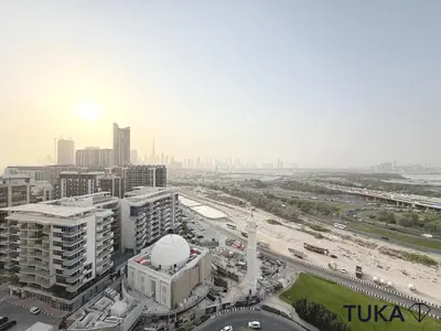 an aerial view of a city with buildings and a freeway at Lux - 2BR - Spacious - Burj Khalifa View - New Bld in Dubai