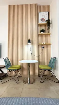 a table and two chairs in a room at Lovely Studio with balcony in Silicon Oasis in Dubai