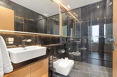 a bathroom with a sink and a toilet at Silkhaus Modern 1BDR Stay in JVC in Dubai