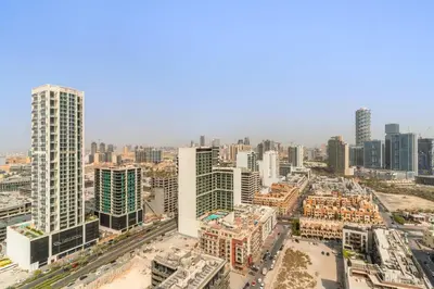 an aerial view of a city with tall buildings at Silkhaus Modern 1BDR Stay in JVC in Dubai