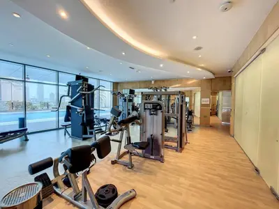 a gym with cardio equipment in a building at Ocean Heights - Upgraded Two Bed with Sea View in Dubai
