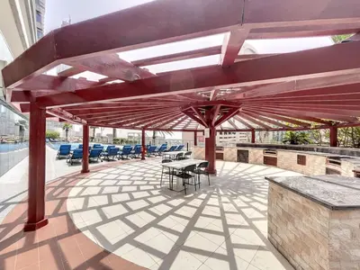 a patio with a table and chairs on a building at Ocean Heights - Upgraded Two Bed with Sea View in Dubai