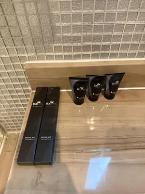 a shelf with three black boxes on it at 2BR Apartment in Paramount Hotel with Burj Khalifa View in Dubai