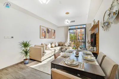 a living room with a couch and a table at Contemporary 2-BR at Belgravia Square JVC in Dubai