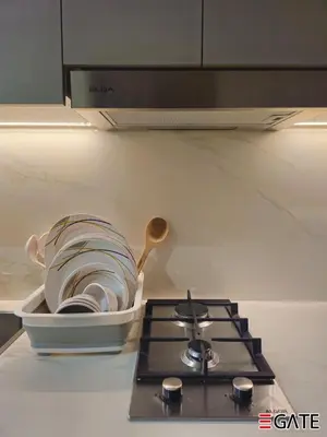 a pile of dishes sitting on top of a stove at EGATE - Studio - 4th Floor - Balcony with a View - 20-423 in Dubai