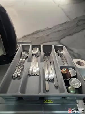 a tray with silver utensils on a table at EGATE - Studio - 4th Floor - Balcony with a View - 20-423 in Dubai