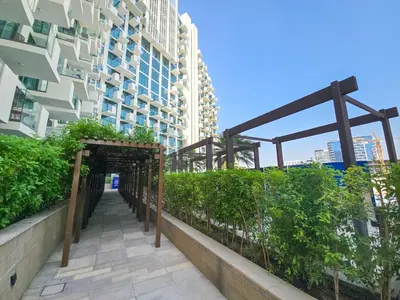 a walkway in a city with a building at EasyGo- City Center, Spacious, Skyline view in Dubai