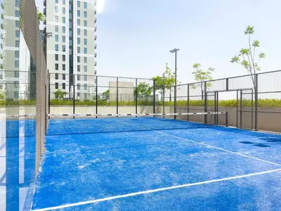 a tennis court in the middle of a building at Chic & Modern 1BR in Socio Near Dubai Hills Park in Dubai