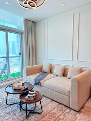 a living room with a couch and a table at Downtown Escape 2BR with Full BurjKhalifa Panorama in Dubai