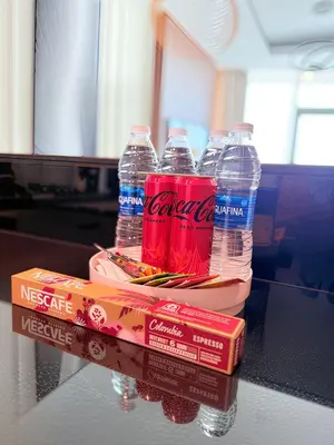 a group of water bottles sitting on top of a table at Downtown Escape 2BR with Full BurjKhalifa Panorama in Dubai