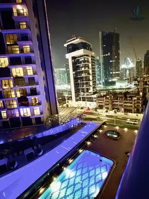 a view of a city at night from a building at Downtown Living - Business Bay 1BR in Dubai