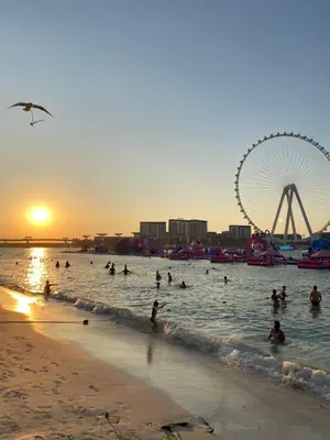 a group of people in the water at a beach at Alsahel Vacation 1 in Dubai