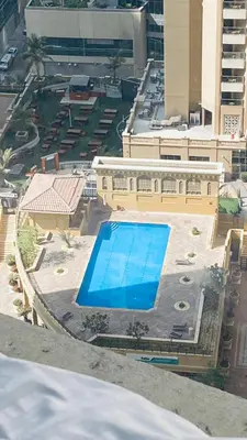 an overhead view of a swimming pool in a building at Alsahel Vacation 1 in Dubai