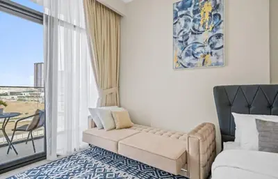 a living room with a couch and a window at Azizi Riviera , Meydan, Dubai Burj Khalifa view in Dubai