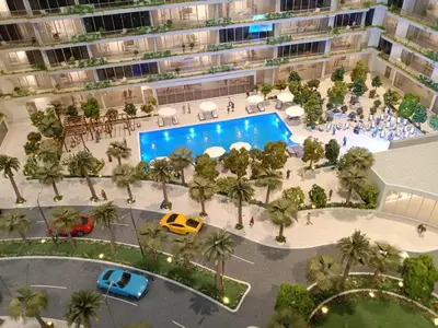 an aerial view of a large apartment complex with a pool at California Village Dubai in Dubai