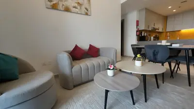 a living room with a couch and two tables at High Floor 2 Bedroom in V Tower in Dubai