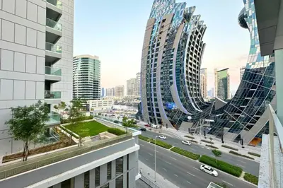 a view of a city with tall buildings and a road at Stunning Burj Views Studio Mins to Dubai Mall 603 in Dubai