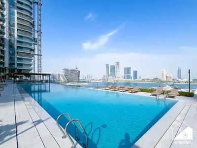 a large swimming pool on the roof of a building at Seaside 1BR Retreat , Beach & Atlantis Views in Dubai