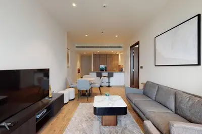 a living room with a couch and a table at Citihome - Luxury 1BR Dubai Marina in Dubai