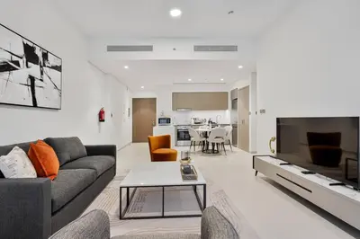 a living room with a couch and a table at CitiHome Modern and Cozy Prime Location in Dubai