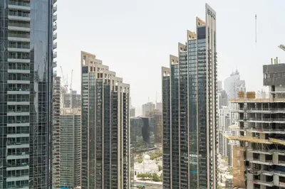 a group of tall buildings in a city at CitiHome Modern and Cozy Prime Location in Dubai