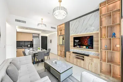 a living room with a couch and a table at 1BR Stay in Burj Crown, Dubai in Dubai