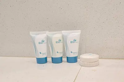 a group of three electric toothbrushes sitting on a counter at 1BR Stay in Burj Crown, Dubai in Dubai