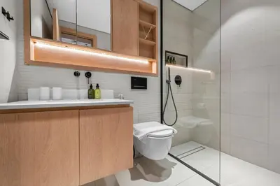 a bathroom with a toilet and a shower at VayK - Contemporary and Cozy Studio in JVC in Dubai