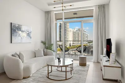 a living room with a couch and a table at VayK - Luxurious 1BR in JLT with Premium Amenities in Dubai