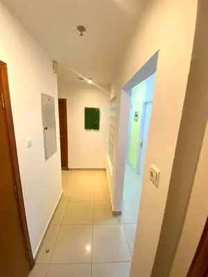 a hallway of a building with a hallwayngthngthngthngthngthngthngthngth at City Edge Room In Barsha Heights Tecom in Dubai