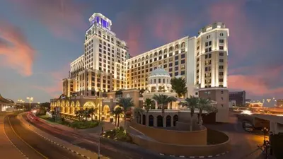 a large white building with a dome on top of it at Comfort Corner In Al Barsha 1 near Mall of Emirates in Dubai