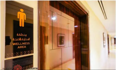 a sign on the wall of a building with a restroom at Dreamstay 2 BR in Business Bay in Dubai