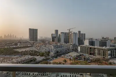 a view of a city with tall buildings at Waves - Vibrant and Cozy 1BR Apt in JVC in Dubai
