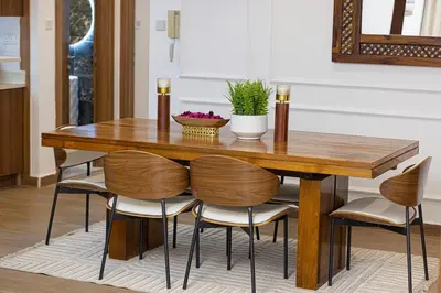 a dining room table with chairs around it at Luxury 2BR w Floating Bed in Dubai Marina Sulafa 4404 in Dubai