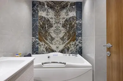 a bathroom with a white sink and a shower at Luxury 2BR w Floating Bed in Dubai Marina Sulafa 4404 in Dubai