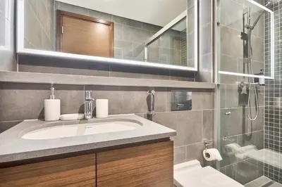 a bathroom with a sink and a shower at STAY BY LATINEM Luxury 1BR Holiday Home CB 1414 Near Downtown in Dubai