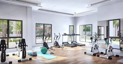 a gym with a lot of treadmills and exercise bikes at FAM Living -Madinat Jumeirah Living Apartment with Iconic Views in Dubai