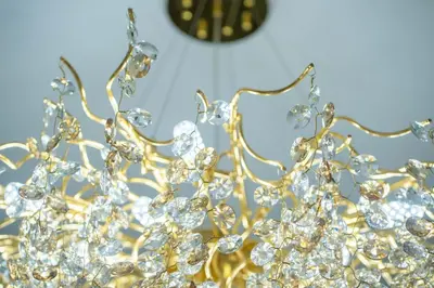 a gold tiara with a clock in the background at KeyRock - Palm View Apt with Pool & Gym Access in Dubai