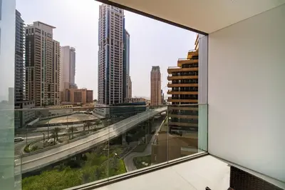 a view of a city from a window in a building at SettlerHomes - Liv Marina Luxe With Gym, Pool, Sauna in Dubai