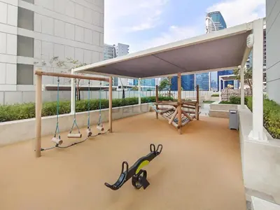 awning on the roof of a building with scissors at City View with Balcony Next to Dubai Water Canal, Walking Distance to Marine Transport Station, Easy Downtown Access, Reva Residences, Business Bay by Deluxe Holiday Homes in Dubai