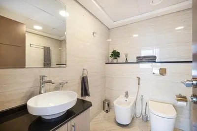 a bathroom with a sink and a toilet at Sea & City View Apartment Dubai Marina - Ravello Living in Dubai