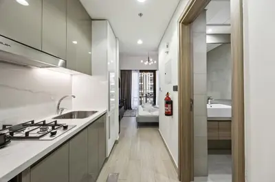 a kitchen with a sink and a stove top oven at Elite Escape - Getaway in Azizi Riviera 26 in Dubai
