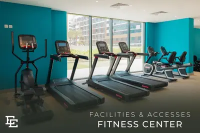 a gym with treadmills and a fitness center at Elite Escape - Getaway in Azizi Riviera 26 in Dubai